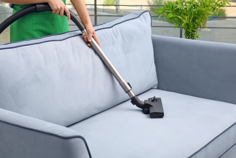 A sofa being cleaned